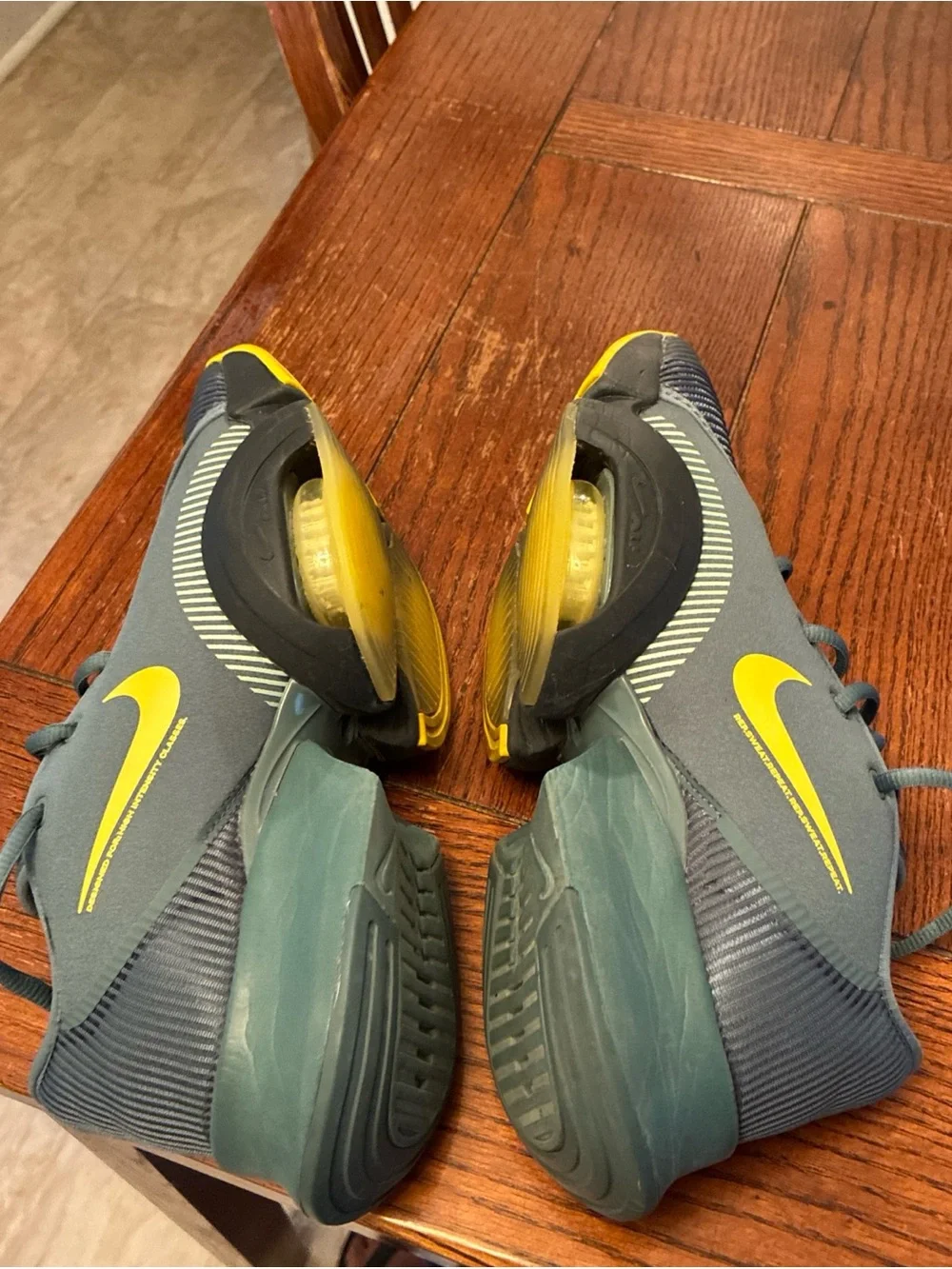 Nike Men’s Gray Athletic Shoes with Yellow Swoosh